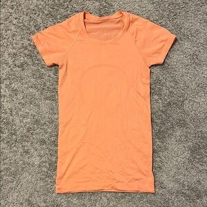 Lululemon Swiftly Tech orange color size 2 hip length used